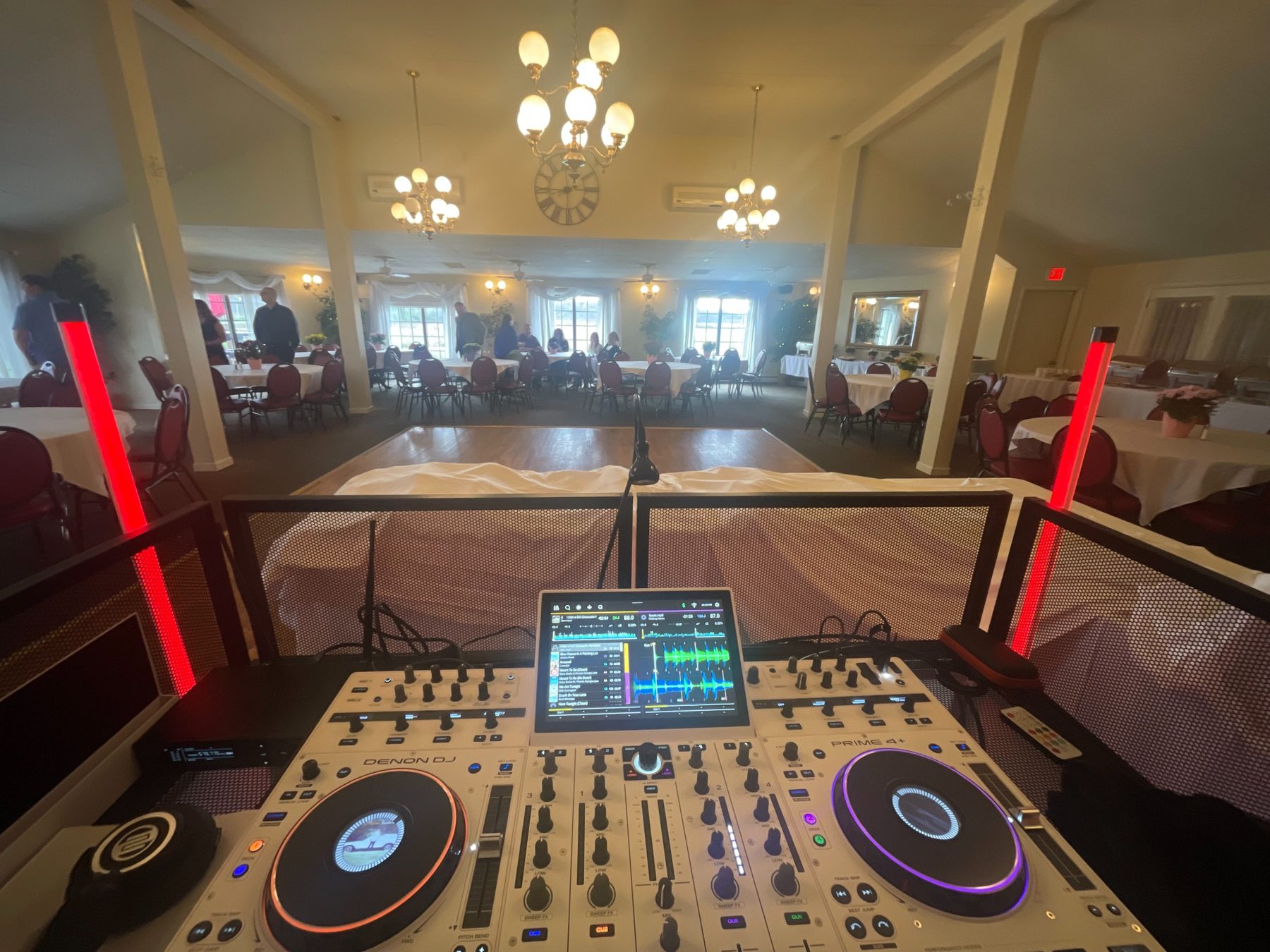 Professional Denon DJ controller overlooking an event dance floor